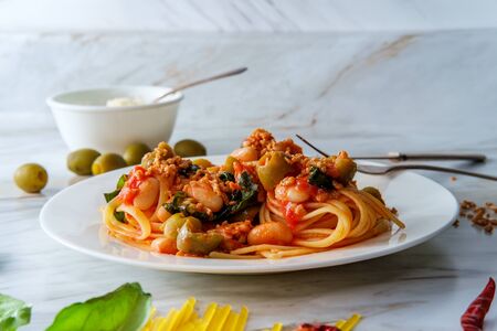 Fettuccine sugo all'arrabbiata Italian pasta with aceituna manzanilla de Sevilla olives garnished...