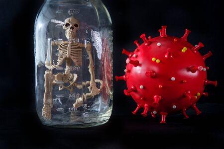 Skeleton quarantined in glass mason jar to keep safe from the deadly coronavirus