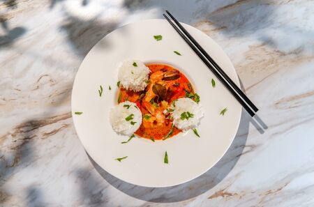 Thai food spicy coconut milk panang kung shrimp curry with string beans bell pepper and kaffir lime leavesの写真素材