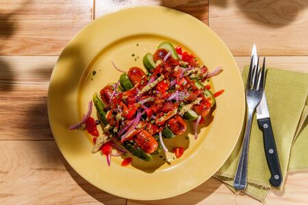 Pickle for a bun gluten free hot dogs with sliced red onions tomatoes bacon bits and chives for...