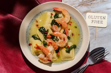 Tuscan creamy shrimp and cheese ravioli with spinachの写真素材