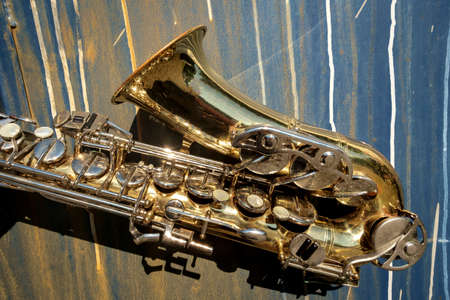 Outdoor Jazz entertainment musical instrument saxophone with grungy street backgroundの写真素材