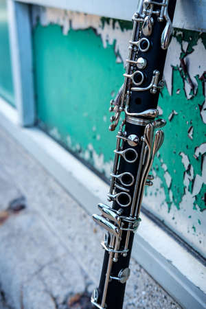 Clarinet outdoor musical show and performance with grunge peeling paint street backgroundの写真素材