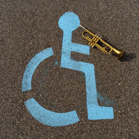 Handicapped parking sign playing trumpet creativity and inclusion conceptの写真素材