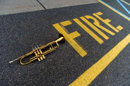 Fire alarm musical instrument trumpet concept with word spelled outの写真素材