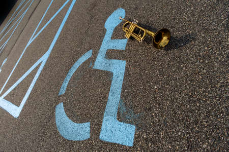 Handicapped parking sign playing trumpet creativity and inclusion conceptの写真素材