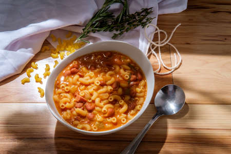Traditional Italian peasant bean soup pasta e fagioli with gluten-free elbow macaroni noodlesの写真素材