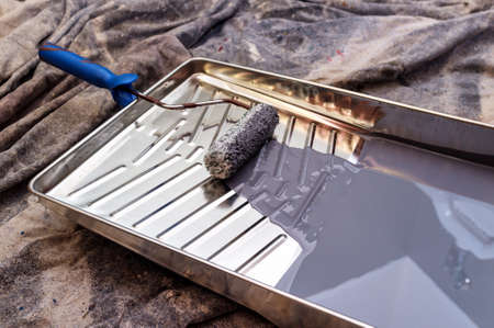 Distressed tarp with tray roller and gray oil paintの写真素材