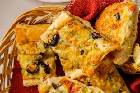 Italian appetizer black and green olive cheesy garlic bread