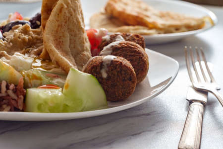 Loaded salad Greek falafel hummus plate with pita breadの写真素材