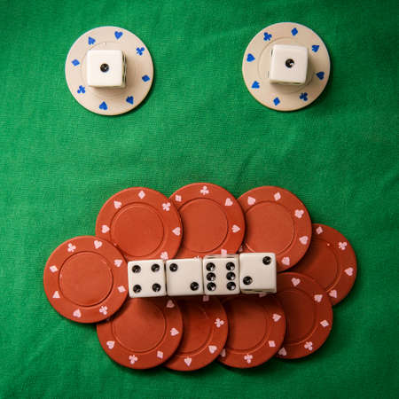 Silly bad poker face metaphor made from various gambling items including dice and poker chips