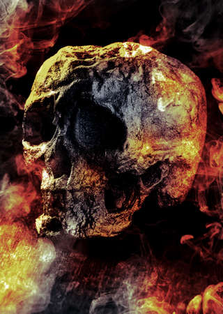 Scary demon Halloween skeleton skull burning in fire