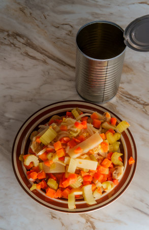 Canned Chinese food chop suey on marble kitchen tableの写真素材