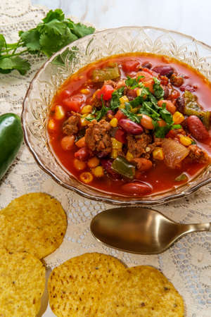 Chorizo sausage chili con carne dinner with corn tortilla chips