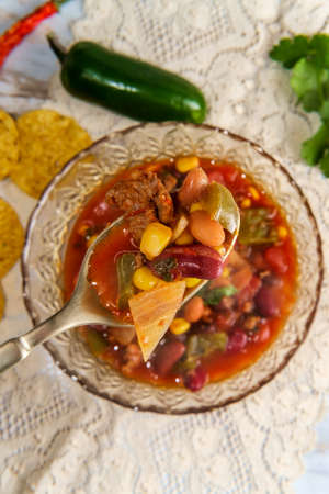 Chorizo sausage chili con carne dinner with corn tortilla chips