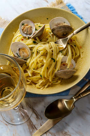 Linguine with littleneck white wine clam sauce and parsley garnish