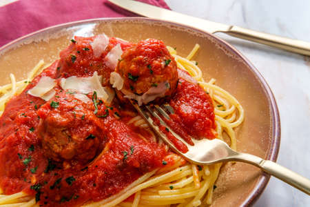 Italian spaghetti and meatballs with red tomato sauceの写真素材