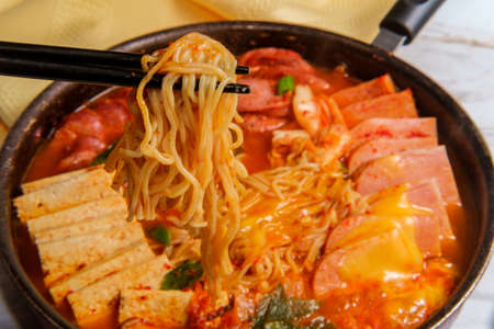 Korean comfort food army base stew also known as Budae-jjigae with sausage tofu and canned ham
