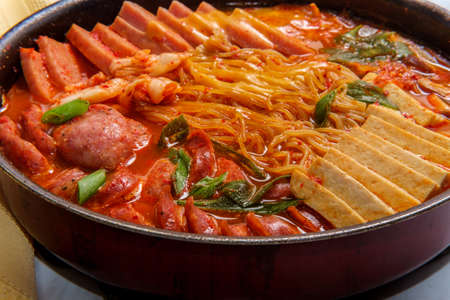 Korean comfort food army base stew also known as Budae-jjigae with sausage tofu and canned hamの写真素材