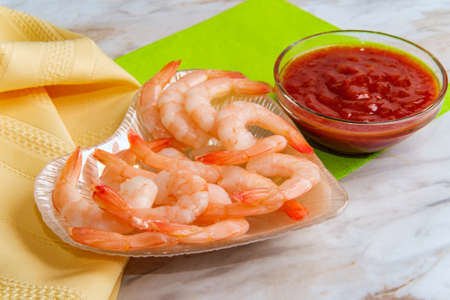 Delightful tail-on shrimp cocktail served with horseradish dipping sauceの写真素材