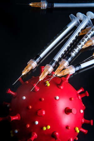 Vaccine needles to prevent spread of deadly coronavirus epidemic and reach herd immunityの写真素材