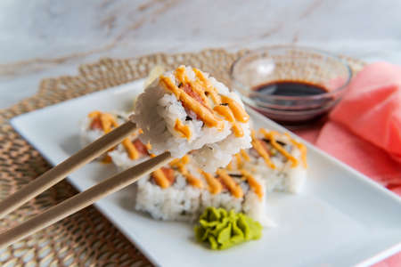 Japanese salmon sushi with spicy sriracha kewpie mayonnaiseの写真素材