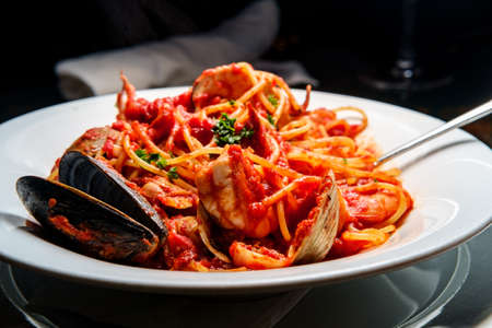 Italian seafood spaghetti pasta pescatore with mussels clams shrimp and squidの写真素材