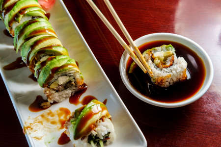 Japanese eel avacado dragon roll with wasabi and pickled gingerの写真素材