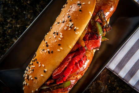 Sausage onions and peppers hoagie sandwich with tuxedo sesame seedsの写真素材
