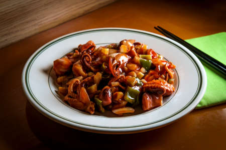 Spicy asian barbecue baby octopus salad with vegetables