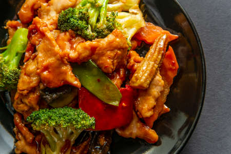 Chinese chicken with garlic sauce on black backgroundの写真素材