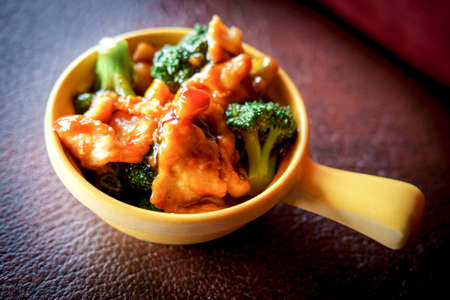 Chinese food chicken and broccoli take out served in bowlの写真素材