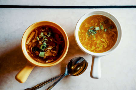 Authentic chinese food wonton soup garnished with sliced green onion