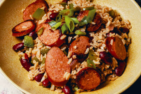 Skillet red beans and rice with smoked andouille sausage and scallion garnishの写真素材