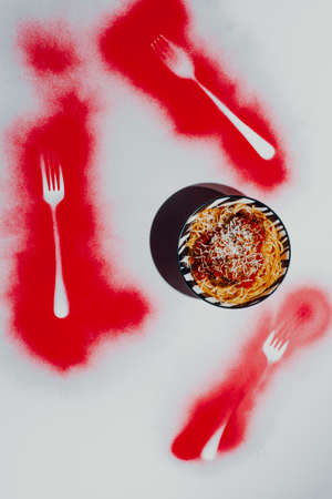 Italian spaghetti and meatballs in marinara sauce with abstract spray paint forkの写真素材