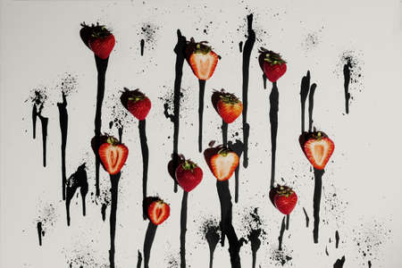 Fresh strawberries on abstract black and white paint drip backgroundの写真素材