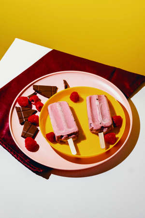 Juicy homemade dairy free oatmilk chocolate chip raspberry icepopsの写真素材