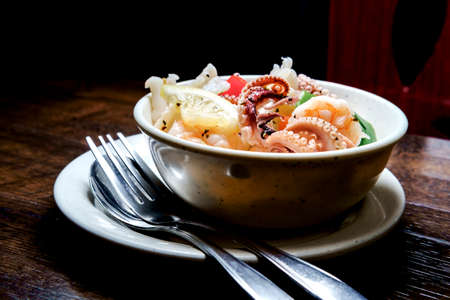 Chilled seafood salad with Shrimp squid octopus tentacles and lemon
