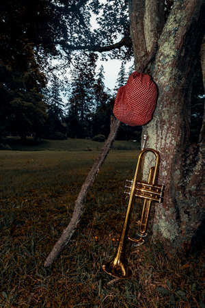 Traveling musicians trumpet and handkerchief picnic sack on a stick