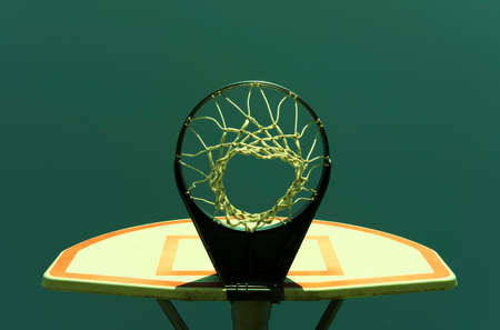 Vintage retro stylized urban basketball hoop against a blue skyの写真素材