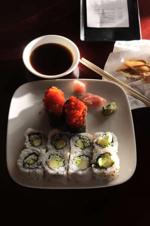Japanese avocado cucumber roll with flying fish roe sushiの写真素材