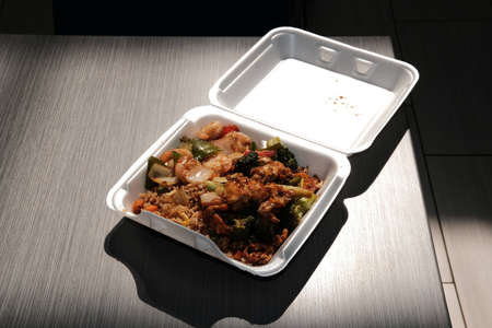 Cafeteria food court chinese food in disposable polystyrene takeout containerの写真素材