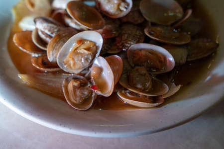 Chinese baby clams on the shell with black bean sauceの写真素材