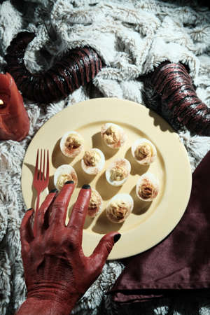 Satans recipe hellish deviled eggs with hornsの写真素材
