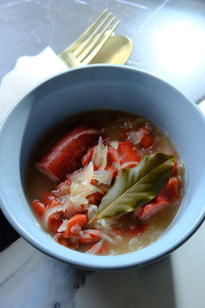 Traditional Polish sauerkraut kielbasa sausage and bean soup