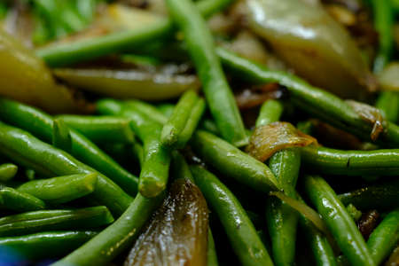 Country roasted green beans and shallots in closeup