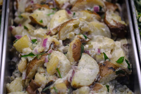 Large server tray of creamy delicious red potato saladの写真素材