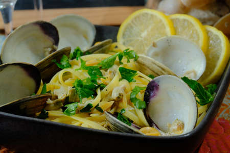Linguine with littleneck white wine clam sauce and parsley garnishの写真素材
