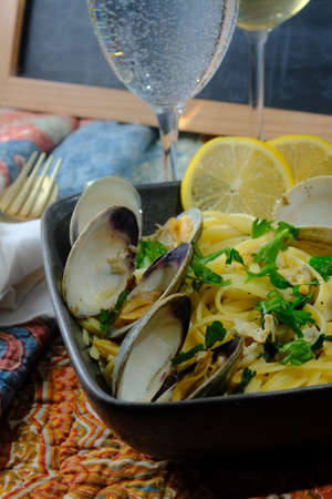 Linguine with littleneck white wine clam sauce and parsley garnishの写真素材
