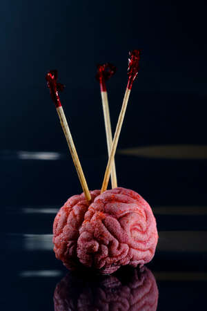 Pick your brain saying taken literally with tooth picksの写真素材